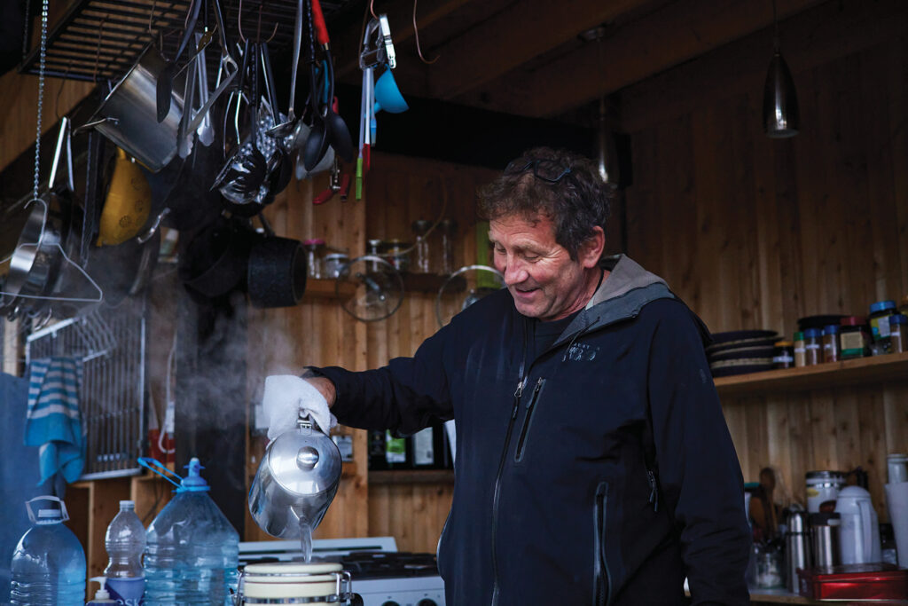 Sylvain Roy makes coffee at his cottage